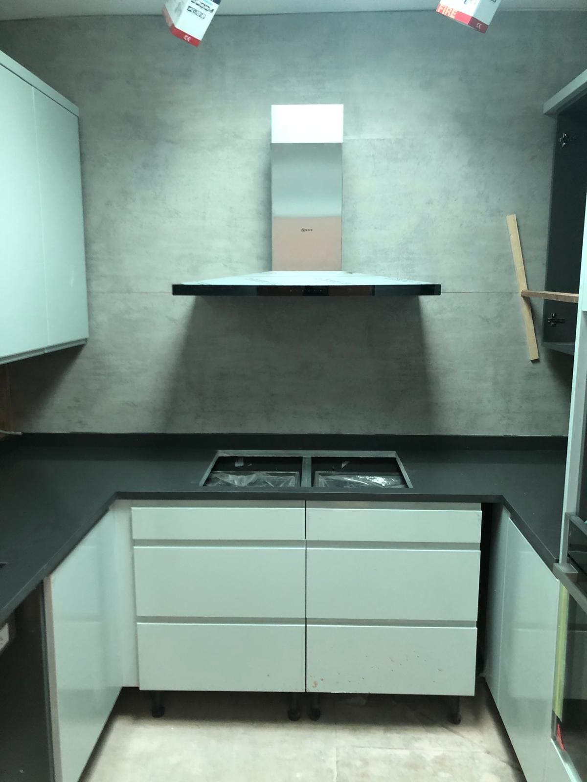 London kitchen installation with new fitted cabinets, dark quartz worktop and extractor by Refurb Squad