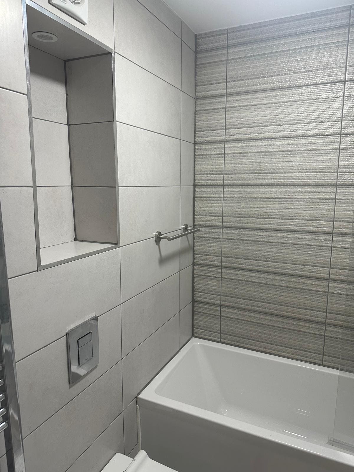 Bathroom refurbishment in a London property showing new tiling and plumbing works