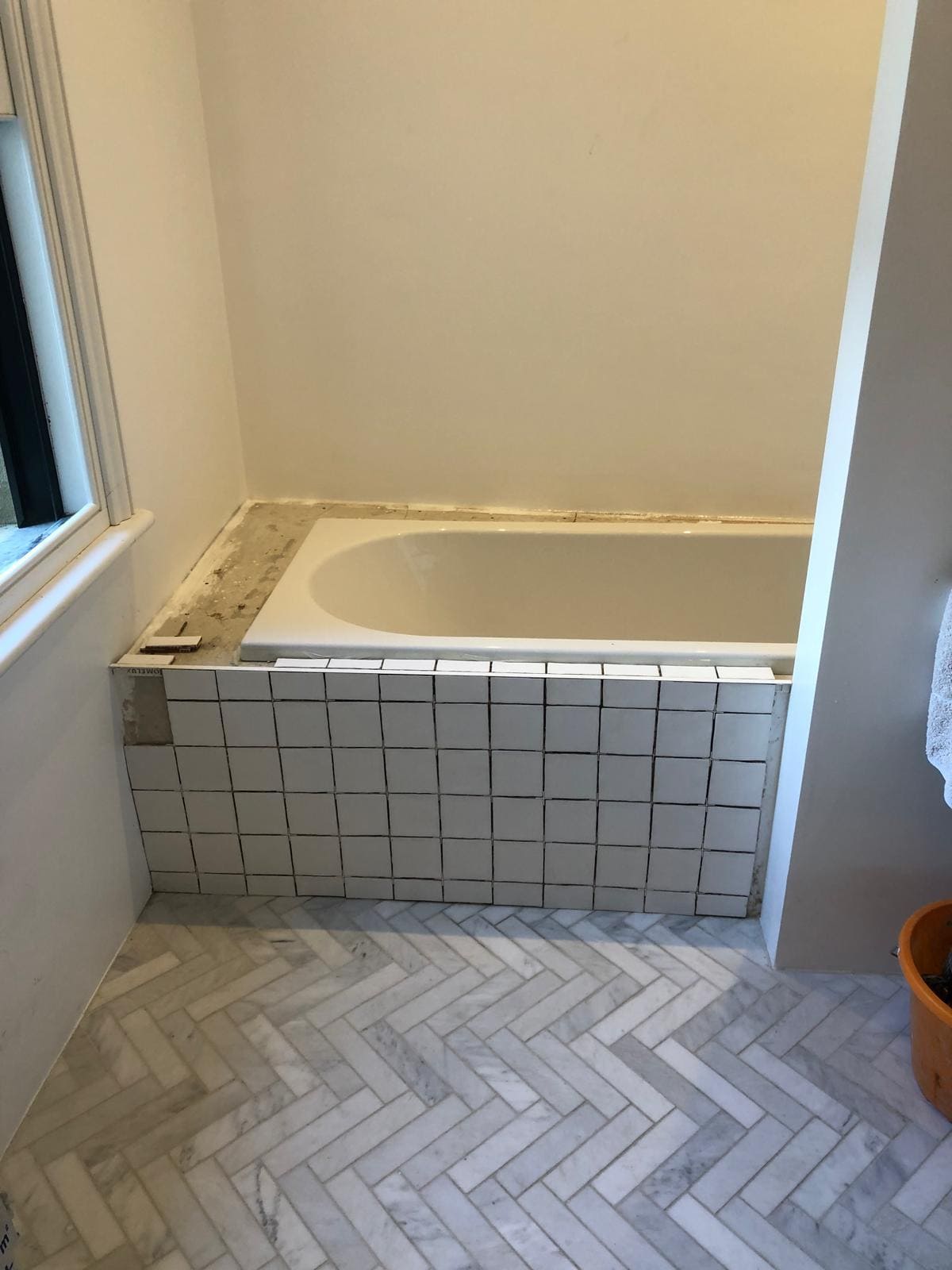 Bathroom installation in London featuring new tiling and fixtures